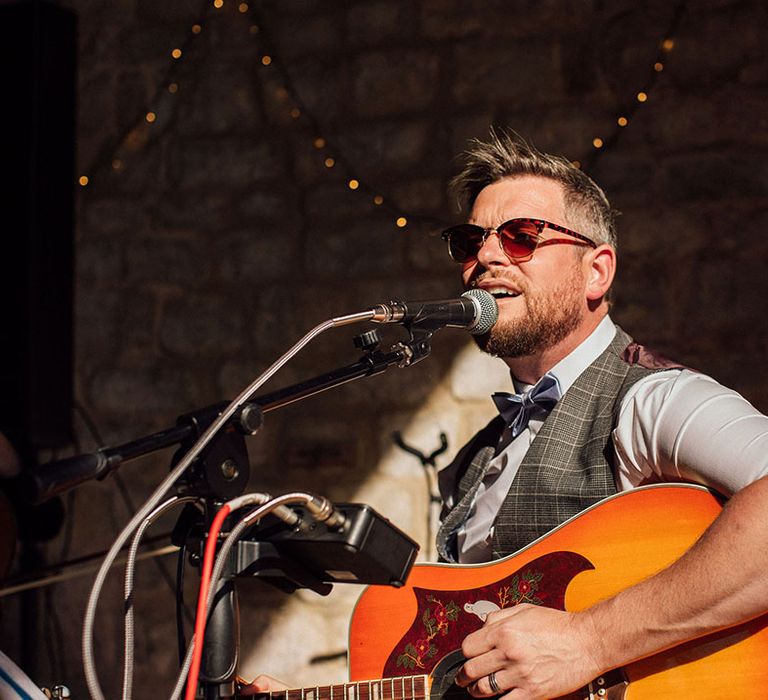 Guitarist plays during Longbourn Estate Barn reception 