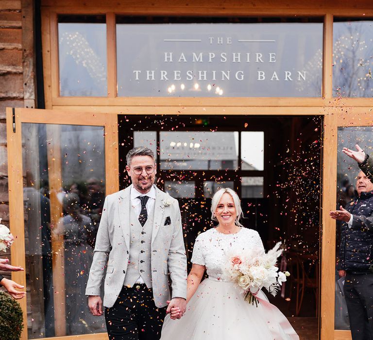 Silchester Farm wedding venue with the bride in bridal separates and the groom in light grey suit for cosy winter wedding 