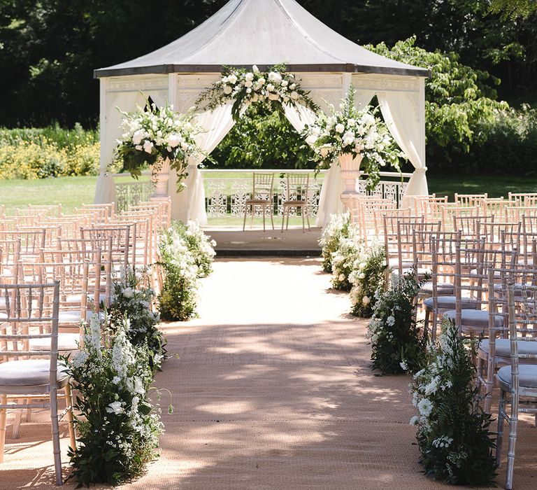 The Manor House, Castle Combe outdoor gazebo wedding ceremony on summer's day 