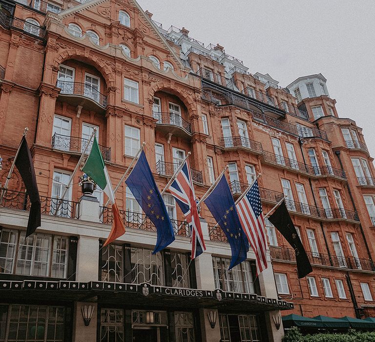 Claridge's wedding hotel venue in London with the flags of different countries above the entrance 