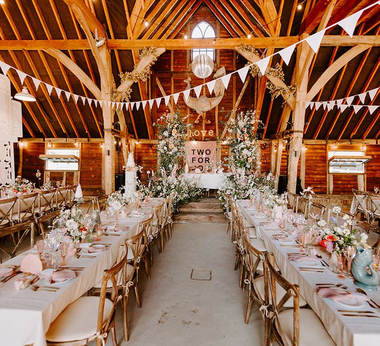 Preston Court wedding with a pastel theme and decorations including pink bunting and lights