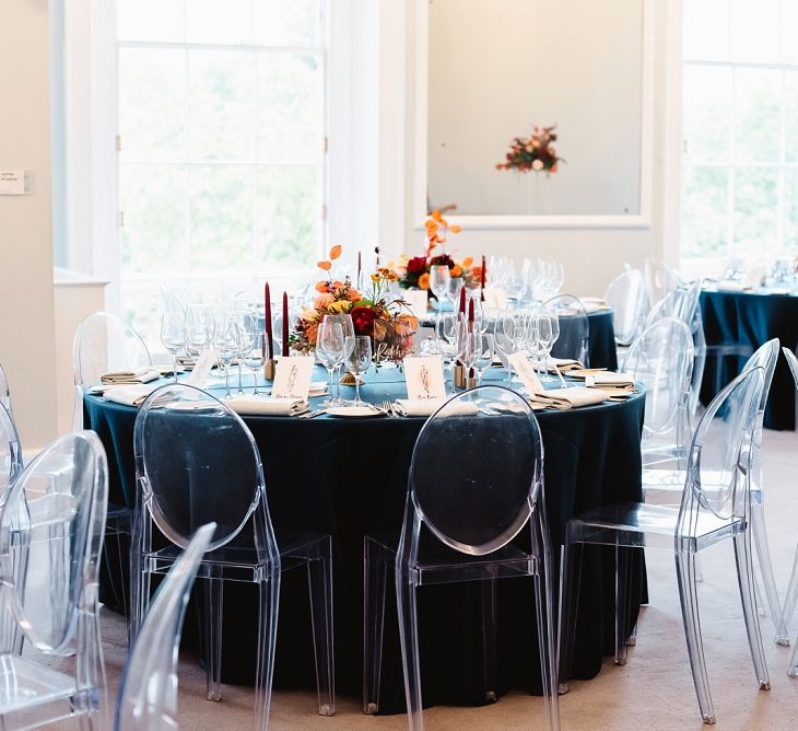 Sophisticated reception tables at Carlton House Terrace wedding with teal linens and ghost chairs