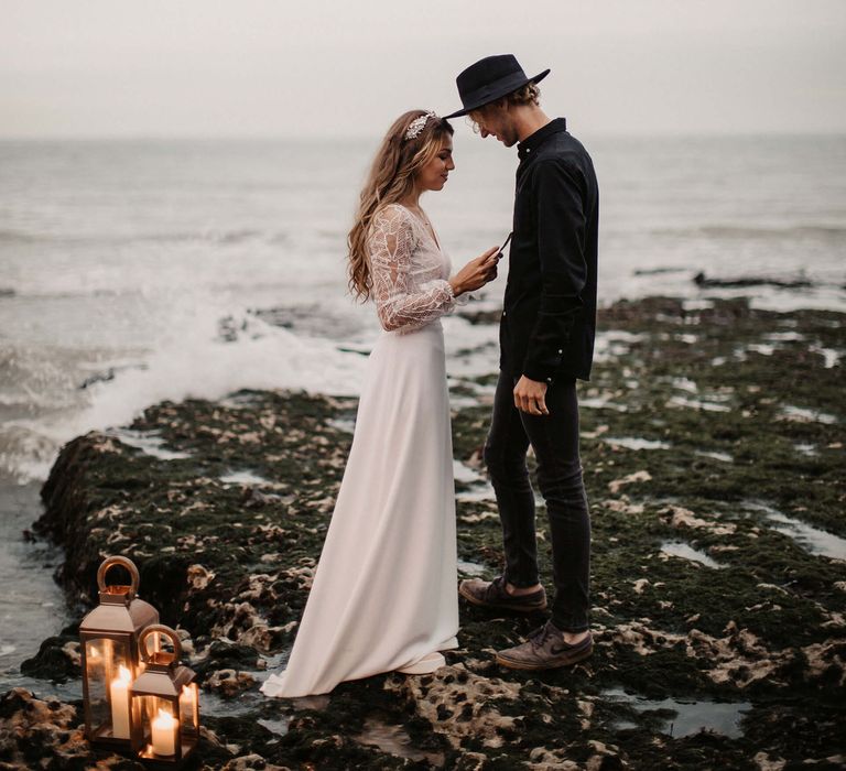 Coastal elopement wedding ceremony on the rocks 