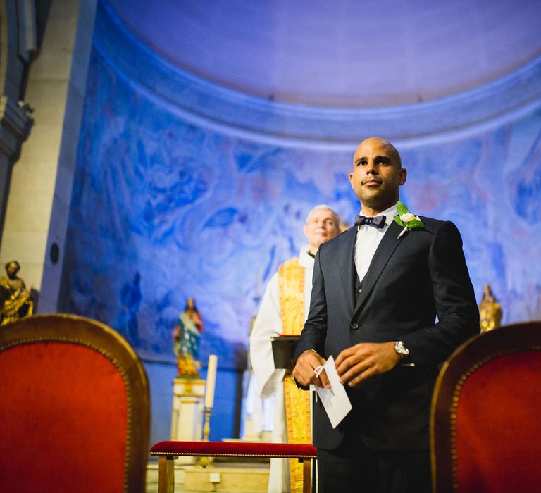 The groom waiting at the church altar for the bride to arrive