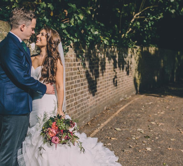 Groom holding his new bride on a London street