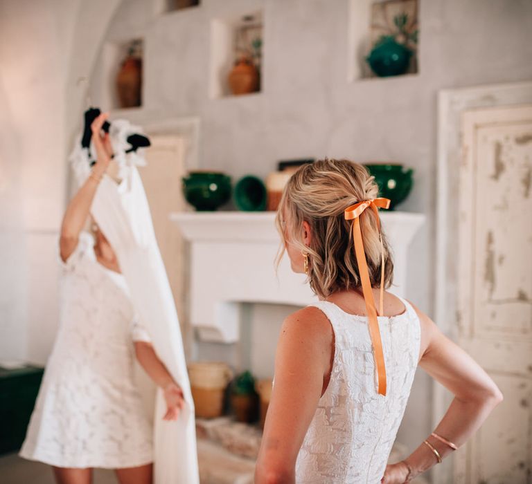 Orange silk hair ribbons and white bridesmaid dresses for Italian wedding at Masseria Potenti