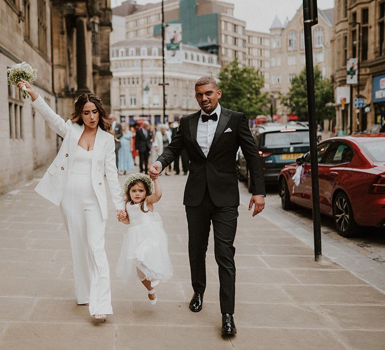 Sheffield registry office wedding with bride in a white suit, groom in a black tuxedo and flower girl with gypsophila flower crown 