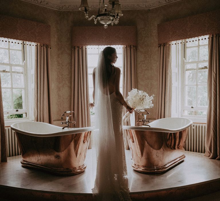 Bride with white bouquet and veil