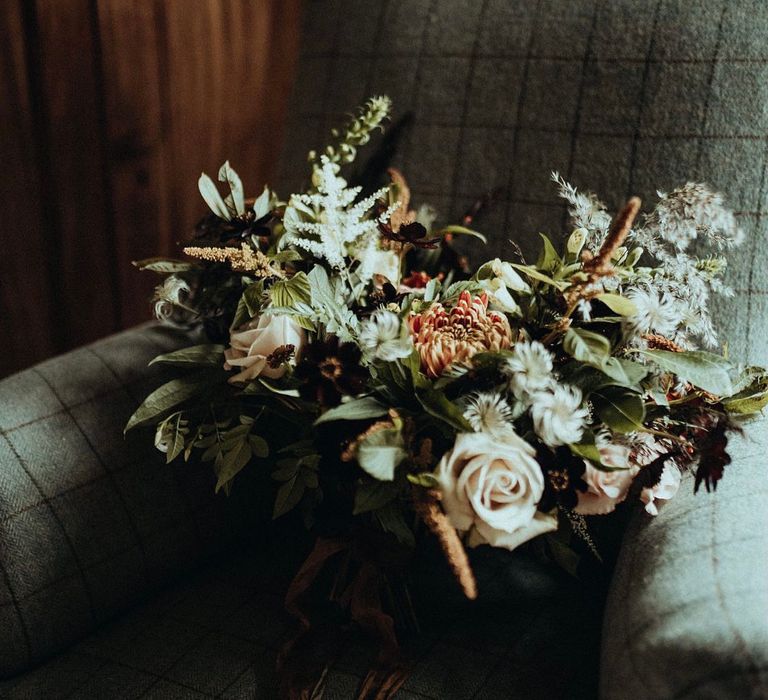 White florals complete with green foliage for rustic bouquet