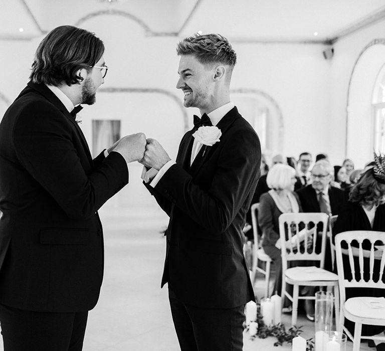 Groom and best man at the altar for an elegant black tie wedding at Northbrook Park 