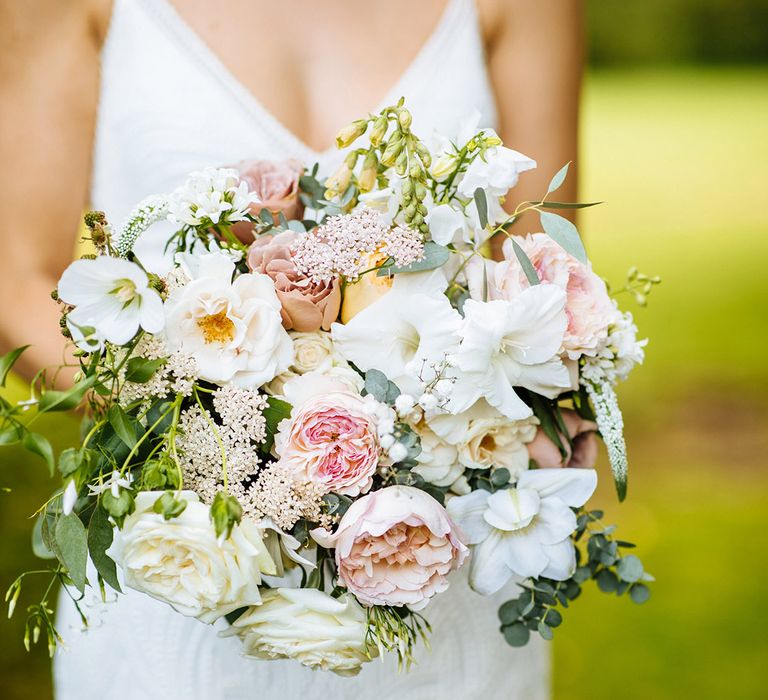 Summer wedding bouquet with pink and white roses, stock and flowers