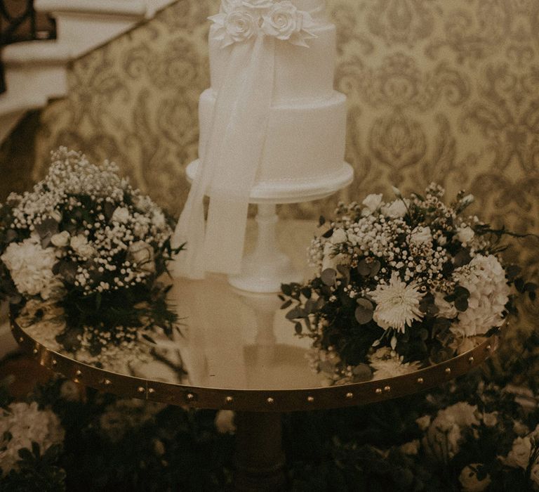 Large white semi-naked wedding cake at Hedsor House wedding