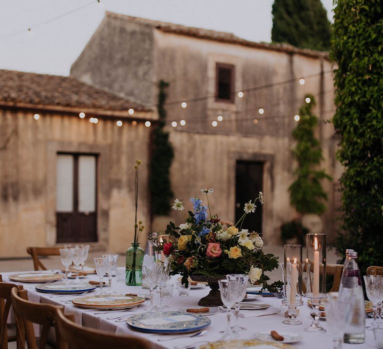 borgo del carato wedding reception with colourful table flowers 