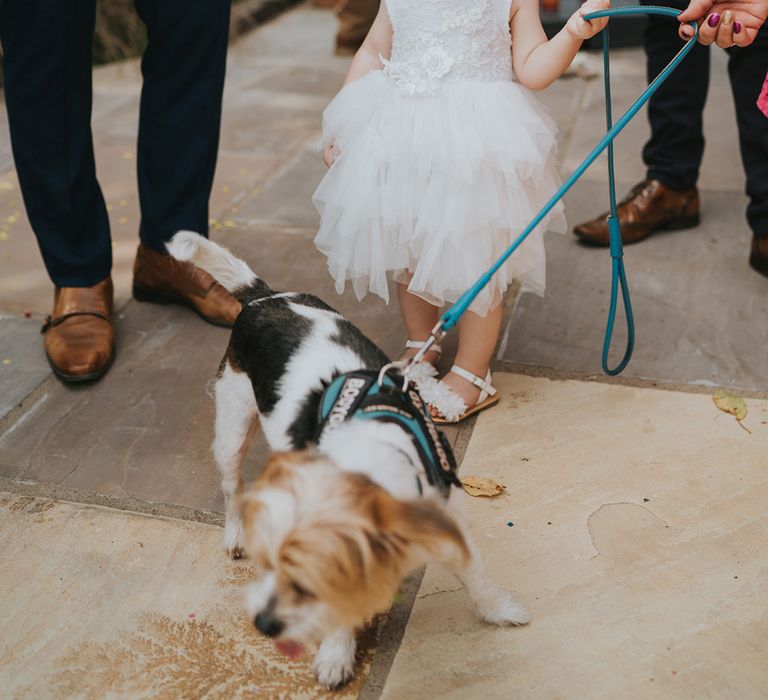 flower girl in a white dress with tutu skirt 