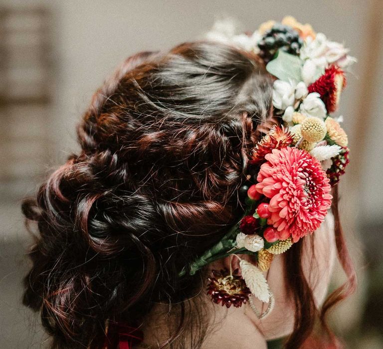 Contemporary bridal up-do wedding hairstyle with rustic boho wedding flower crown 