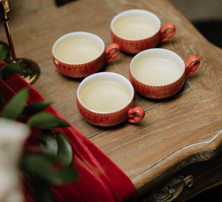 Four cups of tea for the bride's parents and groom's parents as part of the Chinese tea ceremony 