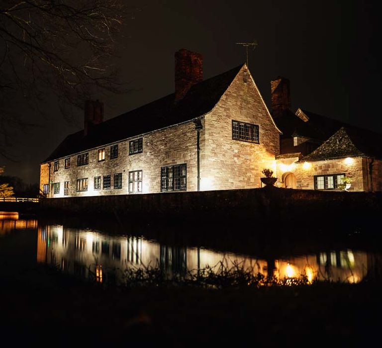 Exterior of Brinsop Court wedding venue at night 