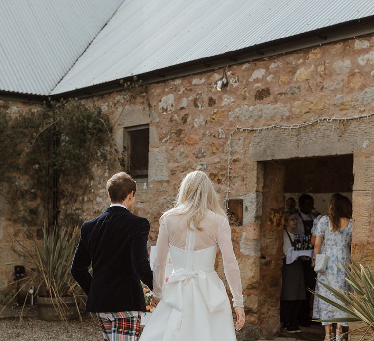 Bride in wedding dress with large bow detail 