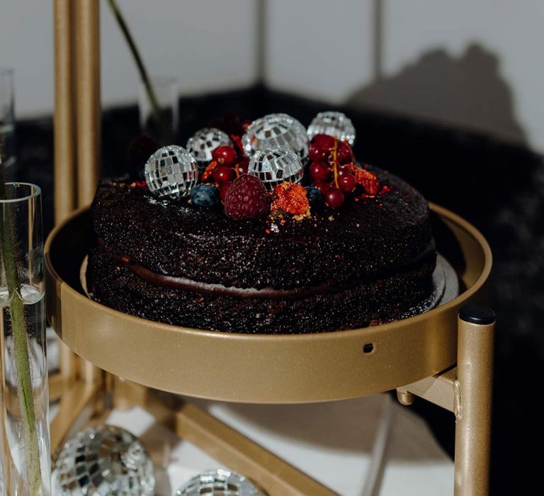 Single tier wedding cake with disco ball toppers and decor at Fabrica Brighton wedding