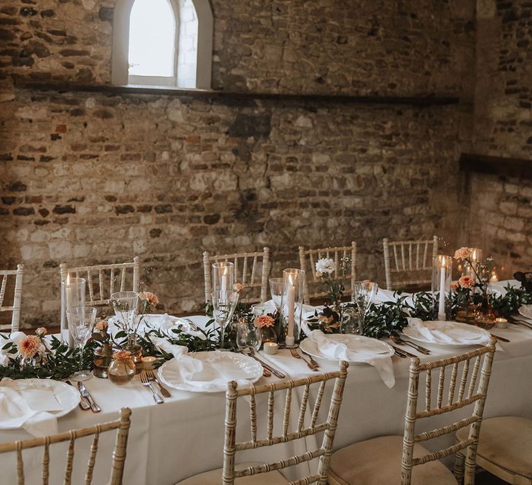 Pentney Abbey wedding venue with white place settings and menus 