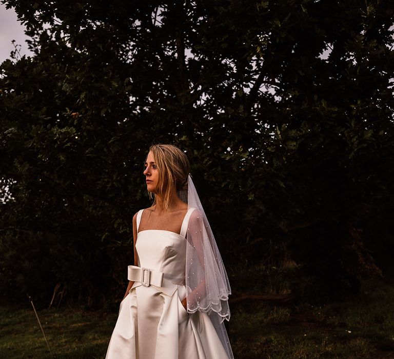 Bride in a square neck wedding dress with a front bow belt wedding dress 