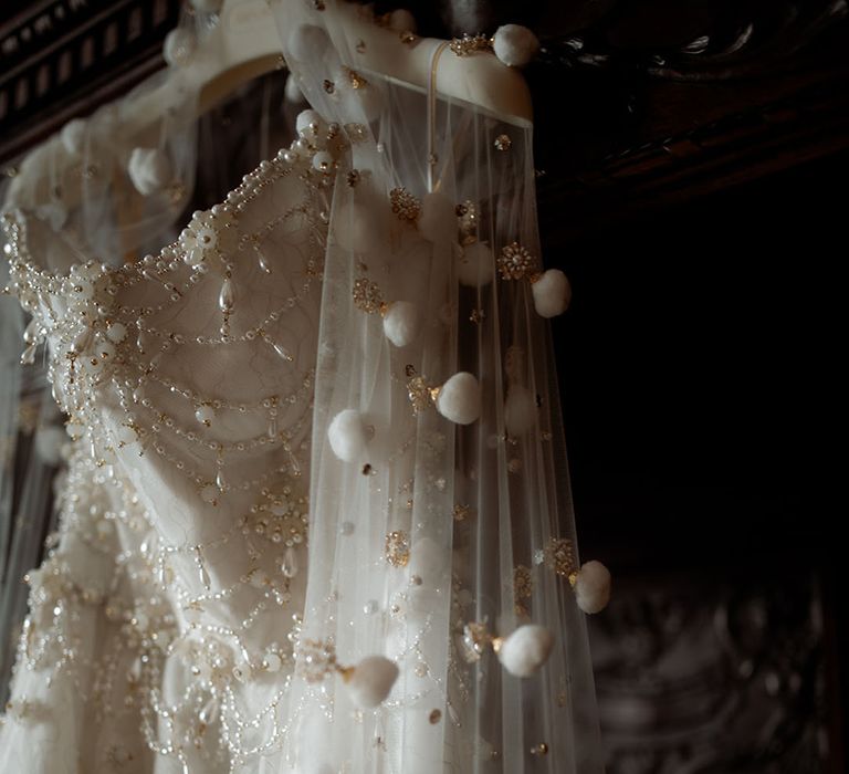 Bride wearing an embellished wedding veil with jewels 