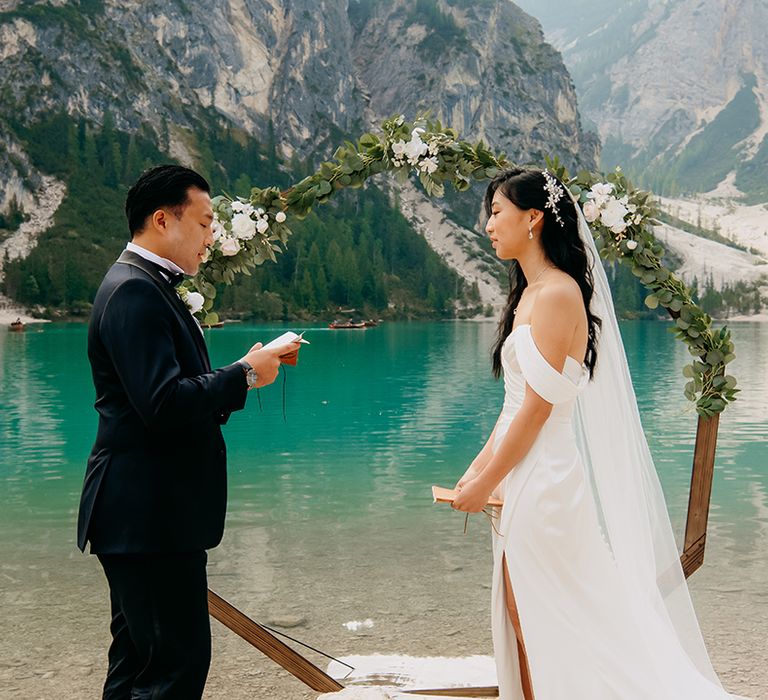 Groom reads out his wedding vows to the bride at their micro wedding 