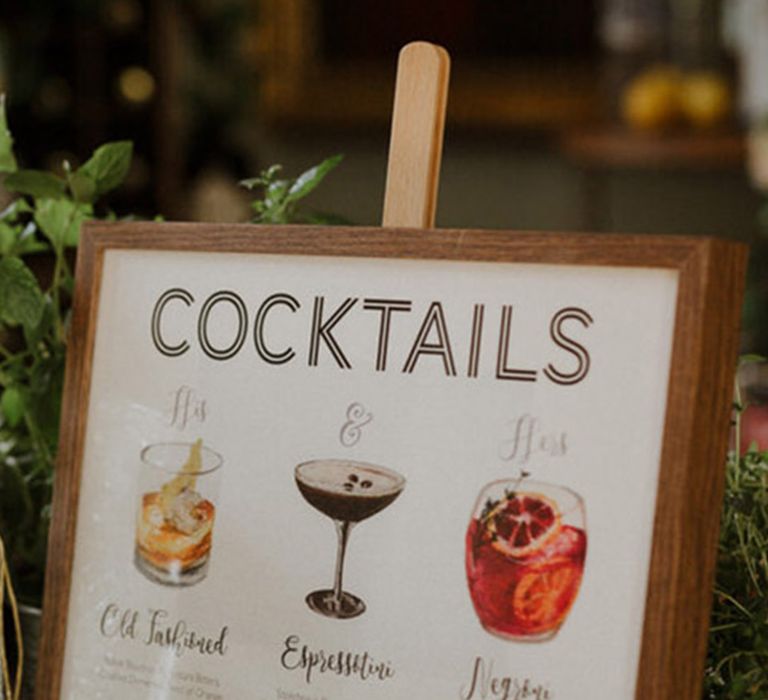 Wedding cocktail menu sign on wooden easel 