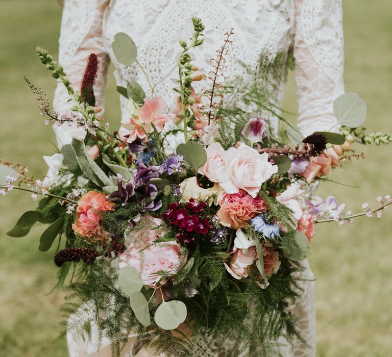 Pink, red, blue, and purple wedding wildflower bouquet