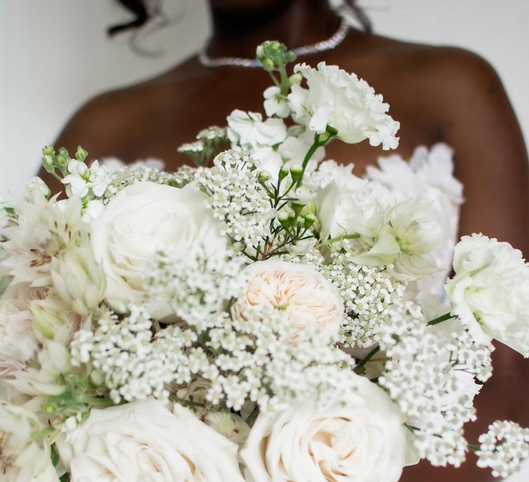 All white wedding bouquet for the bride with roses and Queen Anne's lace 