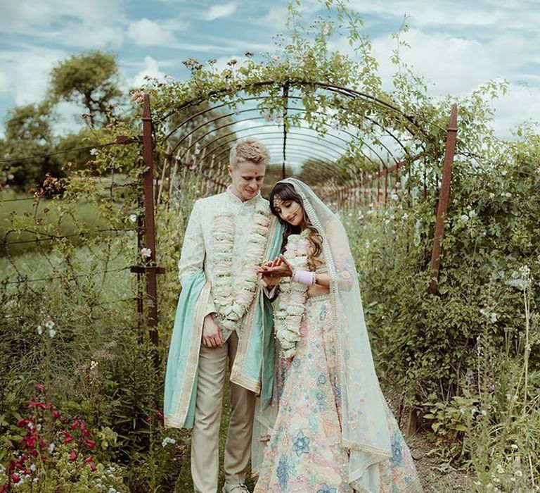 Light mint green sherwani for multicultural wedding at Helmingham Hall 