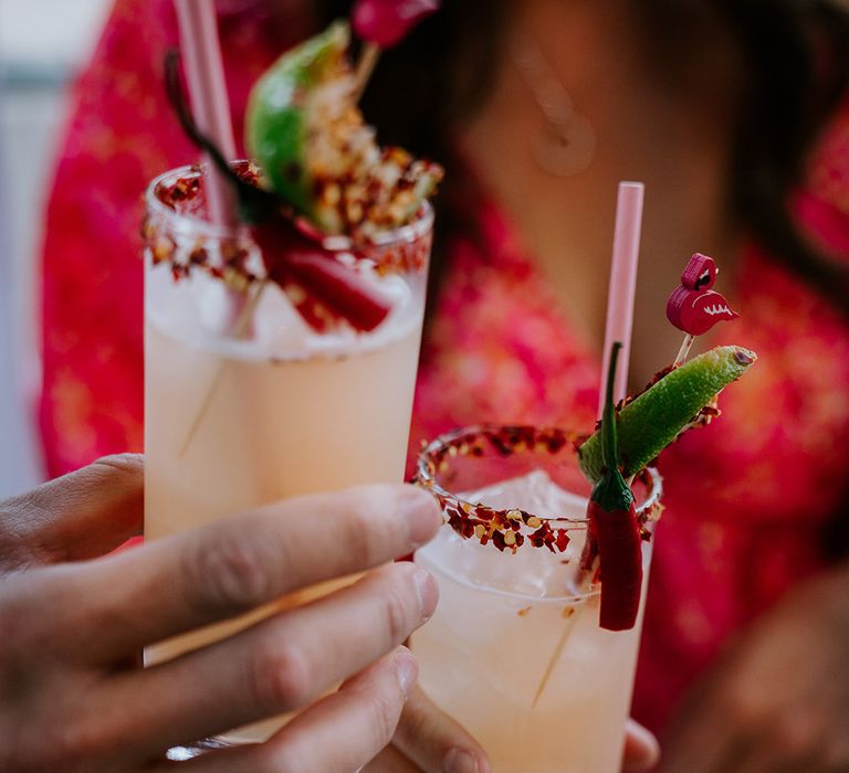 Wedding guests sipping spicy Margarita cocktails