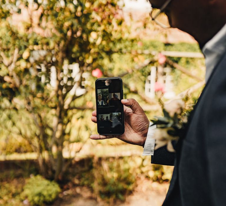 Groom FaceTiming wedding guests 