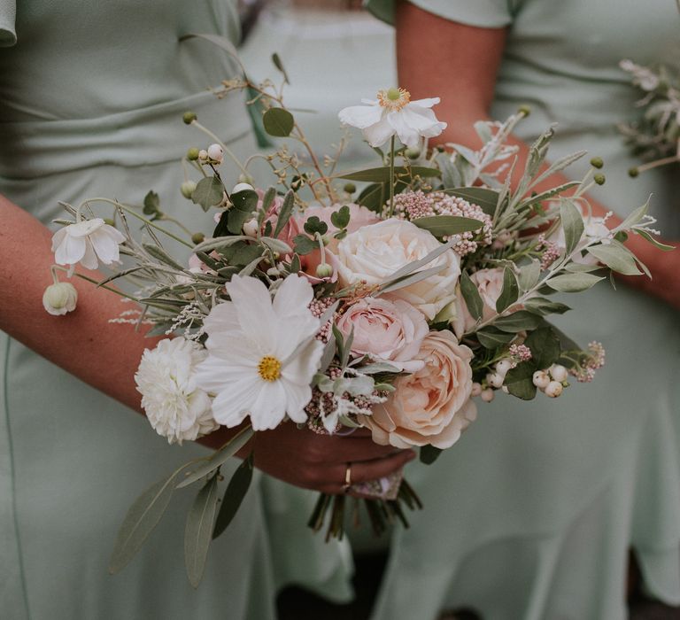 Whistles pastel bridesmaid dresses with pink rose bouquet