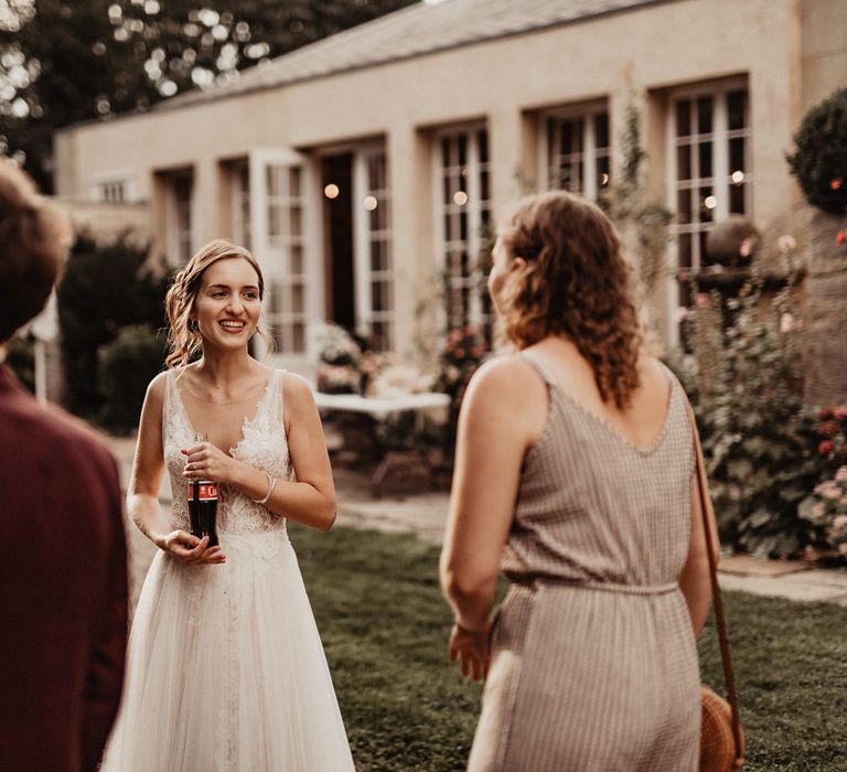 Laughing bride at boho rustic wedding reception