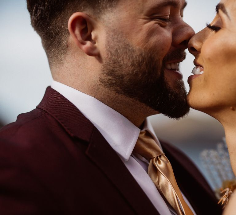 Laughing Bride and Groom touch noses at a small wedding in the Lake District