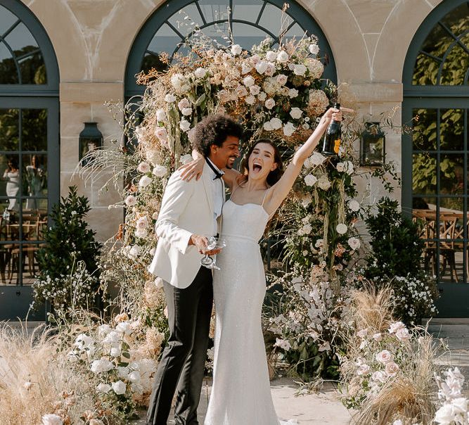 Outdoor wedding ceremony fresh and dried flower aisle and floral arch wedding flowers 