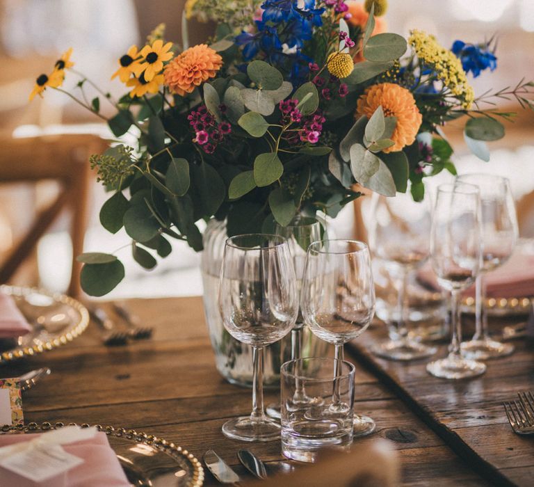 Colourful floral wedding centerpiece at Iscoyd Park wedding reception