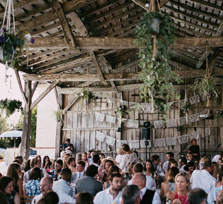 Rustic barn wedding with foliage decor