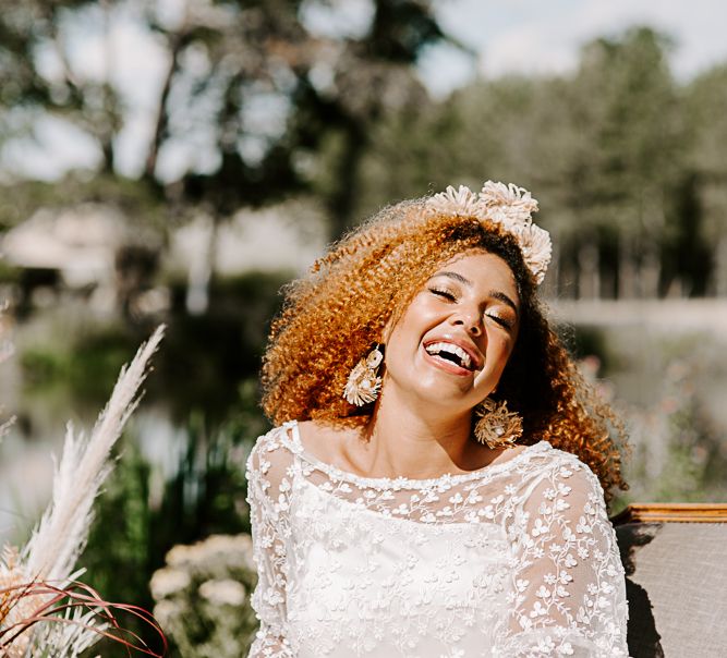 Bride laughs during golden hour outdoors 