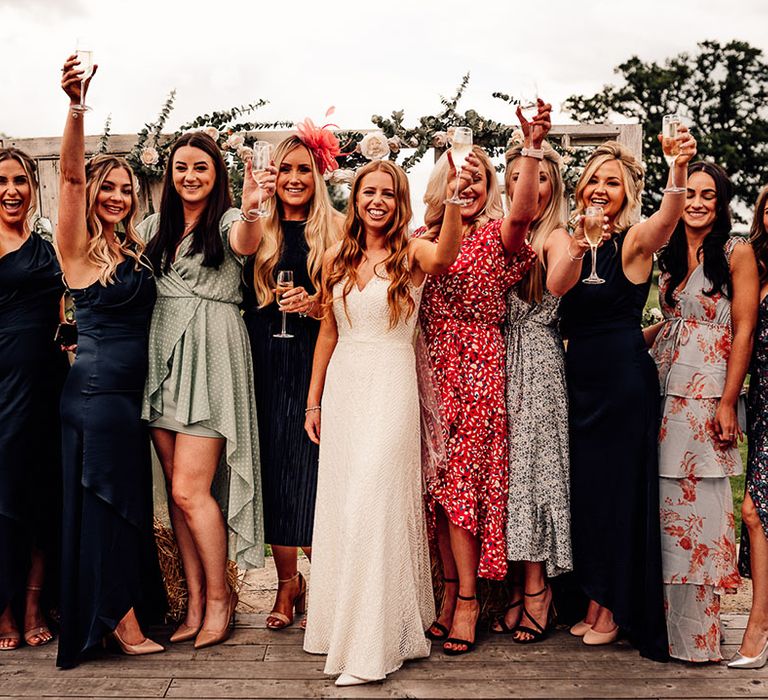 Bride with wedding guests toasting the day