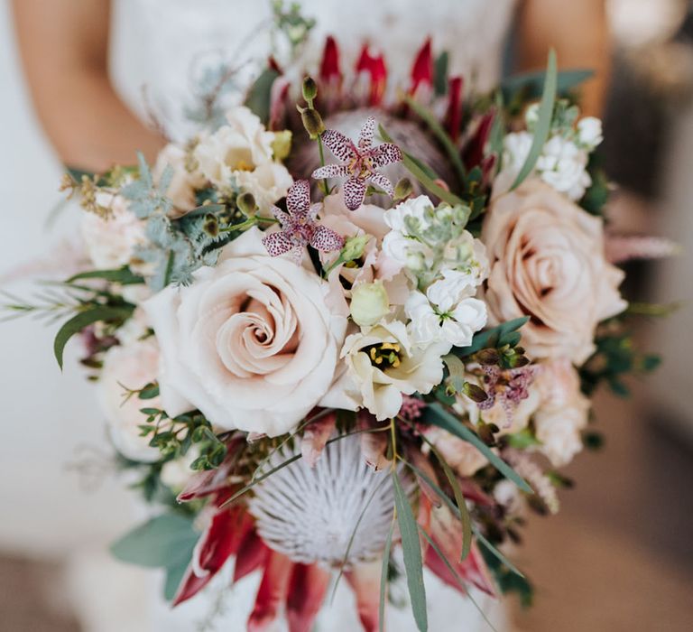 Pink King protea and rose wedding bouquet