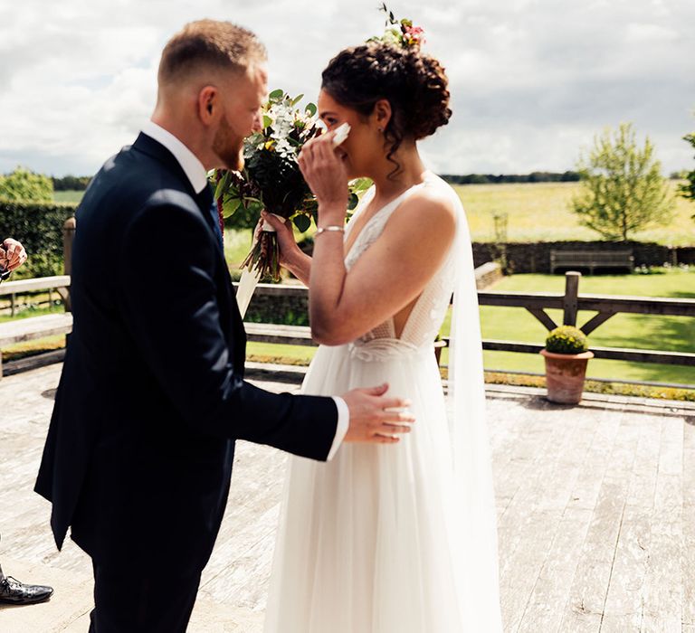 Bride gets emotional at intimate wedding