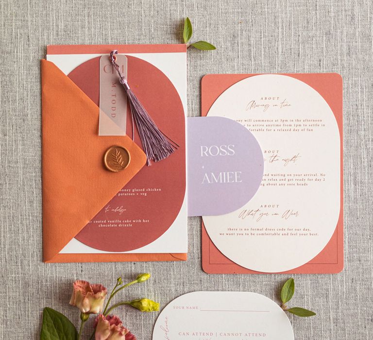 Red, orange and purple wedding stationery with florals for retro meets modern wedding shoot