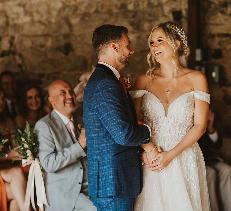 Bride and groom at barn wedding venue