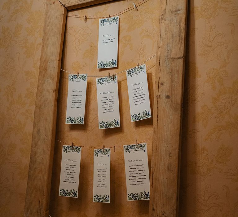 Crafty wedding decoration with printed cards hung on string 