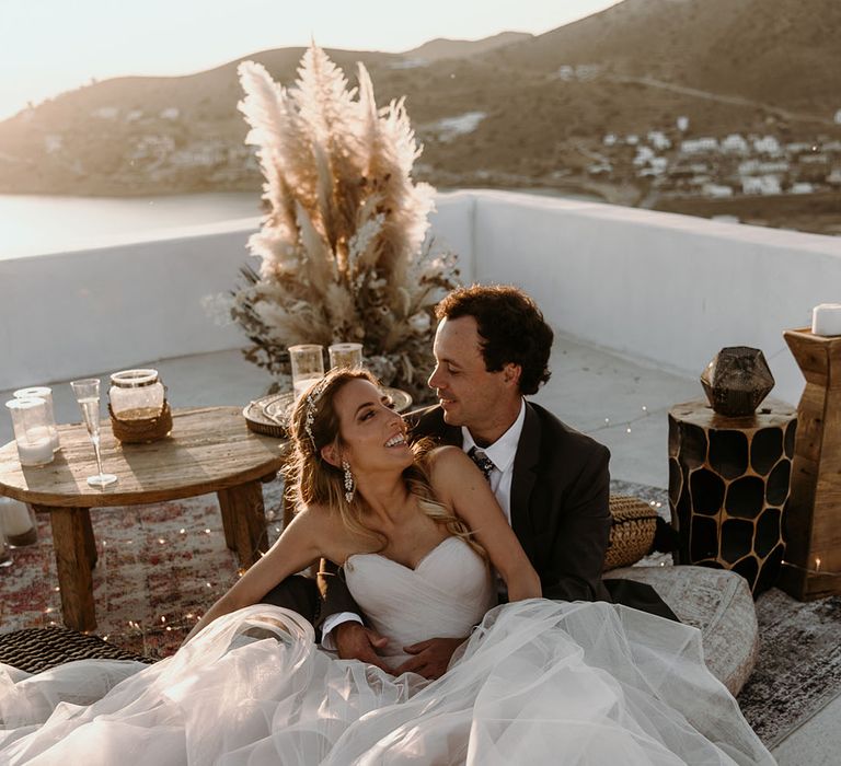 Bride leans into groom on her wedding day