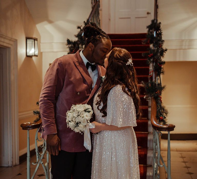 Bride & groom kiss after wedding ceremony