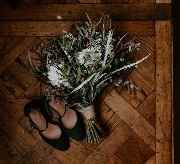 Wedding shoes and floral bouquet