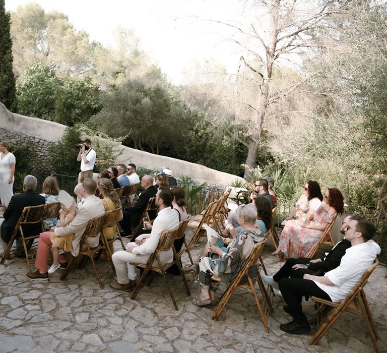 Outdoor LGBTQI+ destination wedding in Barcelona, Spain with stone slabs